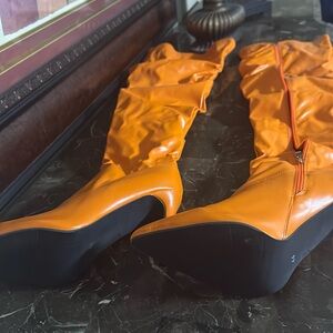 One of a kind orange thigh high boot